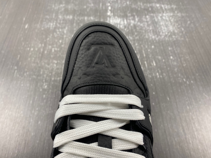 l**is V*t*n trainer all black embossing