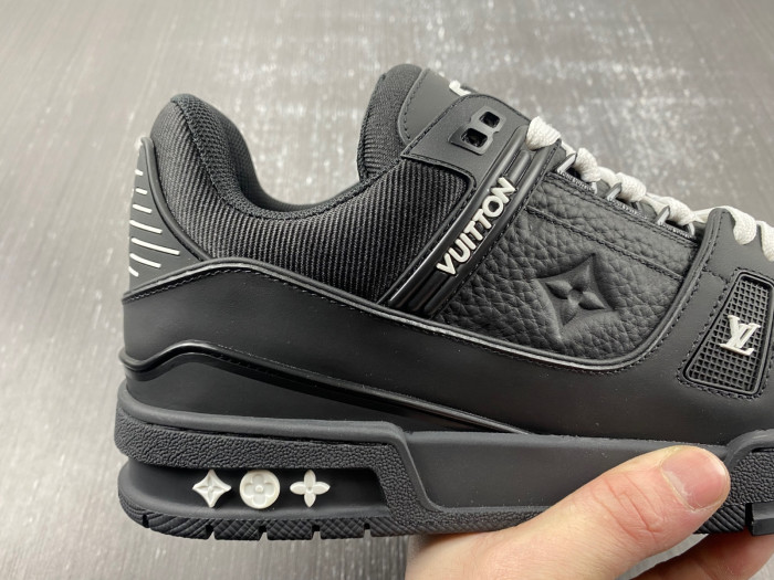 l**is V*t*n trainer all black embossing