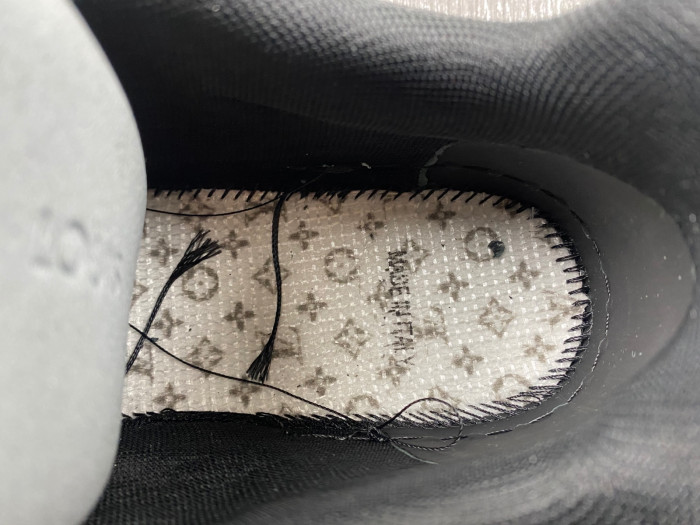l**is V*t*n trainer all black embossing